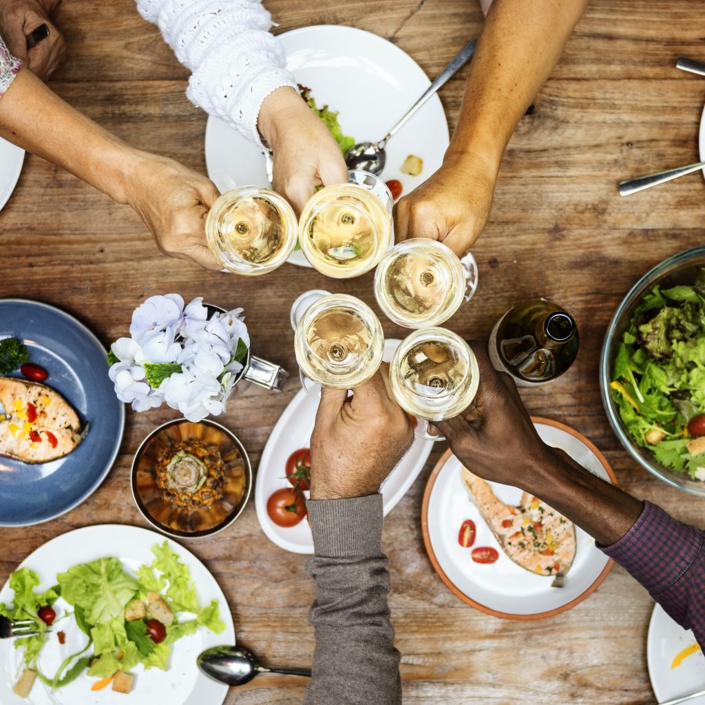 Friends celebrate and share a happy meal.