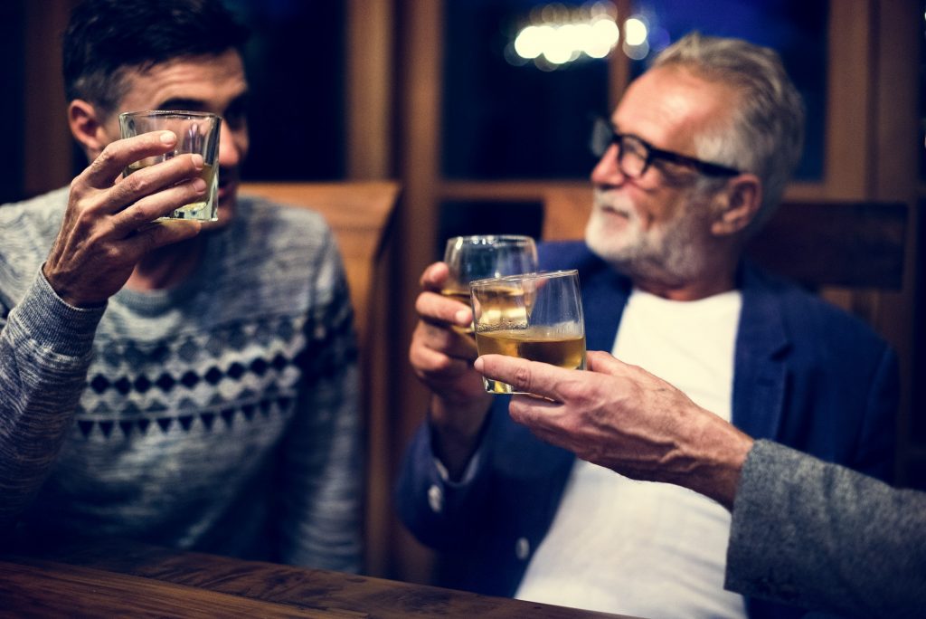 Two friends having a drink together